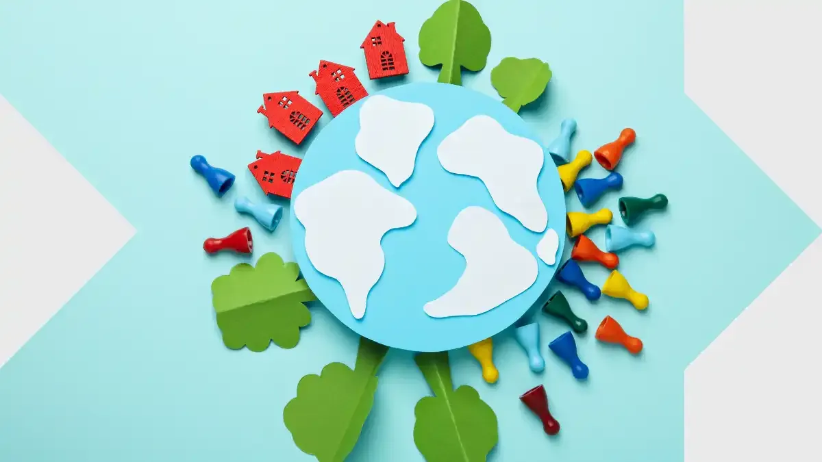 Paper-cut globe surrounded by houses, trees, and colorful figures, representing global families, migration, and connection with sendvalu.